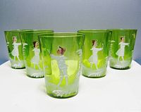 Front view showing all five green glass tumblers with enameled children.