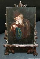Full view of antique miniature painting on carved wooden easel