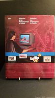 Book front cover showing a woman at a computer surrounded by postal-themed graphics with text: '1994 Collection of the Postage Stamps of Canada / Collection des timbres-poste du Canada'