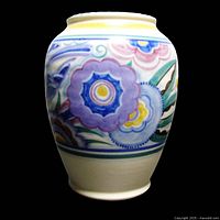 Front view showing the colorful stylized flowers and leaves decoration on cream background with bluebird motif