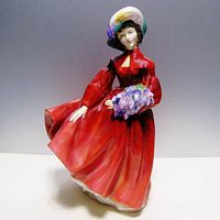 Front view of Royal Doulton Lilac Time figurine showing details of dress, bonnet and lilac bouquet.