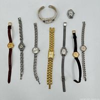 Top view of all 9 vintage ladies watches showing various band styles and face shapes and sizes.