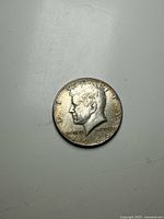 Obverse side of 1969 Silver Kennedy Half Dollar showing John F. Kennedy profile and date.