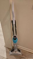Full upright view of the Bissell PowerFresh steam mop showing handle, controls, and mop head.
