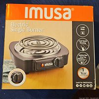 Box of Imusa Electric Single Burner showing front with product image and features.