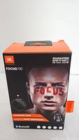 Front view of the JBL Focus 700 headphones box showing branding, model and product image with key features.