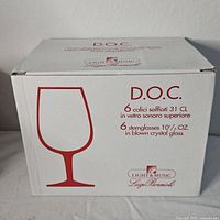 Box showing set of 6 Luigi Bormioli D.O.C. stemmed wine glasses, 31 cl capacity, made of blown crystal glass.