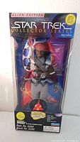 Front view of original box packaging showing the Star Trek Alien Edition Lieutenant Worf action figure in clear window box with colorful space-themed background and branding.