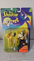 The Shadow Dr. Mocquino action figure in original packaging showing figure and accessories.