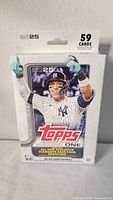 Front view of sealed Topps 2025 Series 1 Baseball Hanger Box featuring a New York Yankees player, highlighting the 59 card count and new condition.