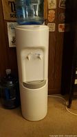 Front view of Crystal Mountain top-load water cooler with bottle attached