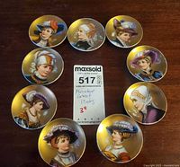 All nine miniature portrait plates arranged in circle with MaxSold card