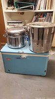 Coleman cooler with two stock pots on top