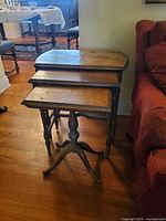 Three graduated nesting tables side view