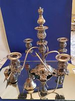 Front view of silver plate 5-light candelabra with accessories