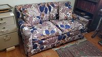 Front view of Simmons floral loveseat sleeper sofa