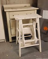 cabinet and step stool together showing size and wear