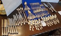 Full layout of all flatware pieces on table