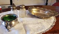 Group view showing tray, footed salt cellar with liner, pair of shakers