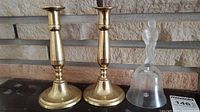 Pair brass candlesticks and glass bell together