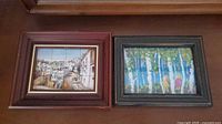 Both framed ceramic tile murals side by side