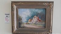 Framed cottage landscape painting front view with measurement tag
