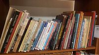 Full shelf view showing majority of the 30+ books