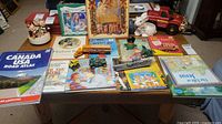 Overall view of books, vehicles and figurines on table
