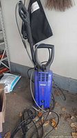 Full view of Simoniz S1500 pressure washer with hose and wand