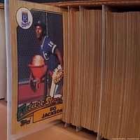Photo showing Bo Jackson 'Future Stars' rookie card in excellent condition with thick stack of baseball cards