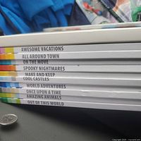 Photo shows stack of 10 LEGO Idea Collection books with spine titles visible, detailing themed building ideas like vacations, town, castles, animals, and more.