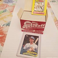 Original red and white cardboard box for 1989 Topps Baseball Picture Cards "Traded" Series, showing card numbers 1-T through 132-T. Box is open with card on top.