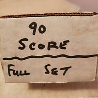 Close-up of brown cardboard box labeled '90 Score Full Set' showing the lot includes the full 1990 Score MLB card set.