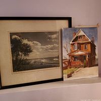 Framed vintage black and white Lake Ontario photograph alongside an unframed watercolor painting of a house, both showing age wear.