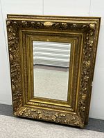 Full view of ornate gilt wood mirror front