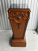 Full view of mahogany pedestal with marble top