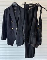 Blazer, vest and trousers displayed together