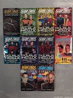 Front covers of 10 Star Trek The Next Generation novels showing titles and cover art including Double Helix series and others