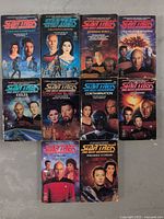 Front covers of 10 Star Trek: The Next Generation paperback novels neatly arranged in two rows.