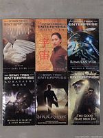 Front covers of six Star Trek Enterprise paperback novels showing titles and artwork.