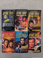 Front covers of 6 Star Trek paperback novels showing titles and cover art features key Star Trek characters.