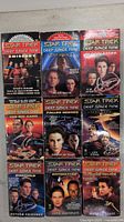 Front covers of 9 Star Trek Deep Space Nine paperback novels showing characters and titles