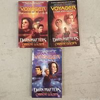 Front covers of the three Star Trek Voyager Dark Matters books showing artwork and titles.