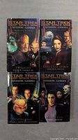 Front cover of four Star Trek Deep Space Nine Mission Gamma books titled Twilight, This Gray Spirit, Cathedral, and Lesser Evil.