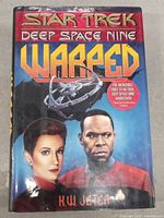 Front cover of hardcover book showing Star Trek Deep Space Nine Wrapped title, characters, and author K.W. Jeter.