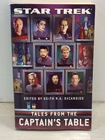 Front cover of Star Trek: Tales From The Captain's Table book showing Star Trek character portraits and book title.