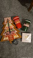 Entire lot showing tree-shaped board, knife, two mugs and napkin pack