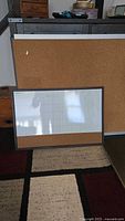 Large cork board behind smaller calendar board