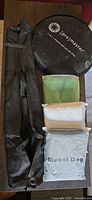 Entire lot showing carry case with stands, fabric backdrops and reflector disc