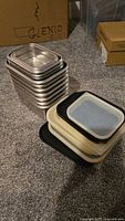 Stacked stainless steel containers with silicone lids
